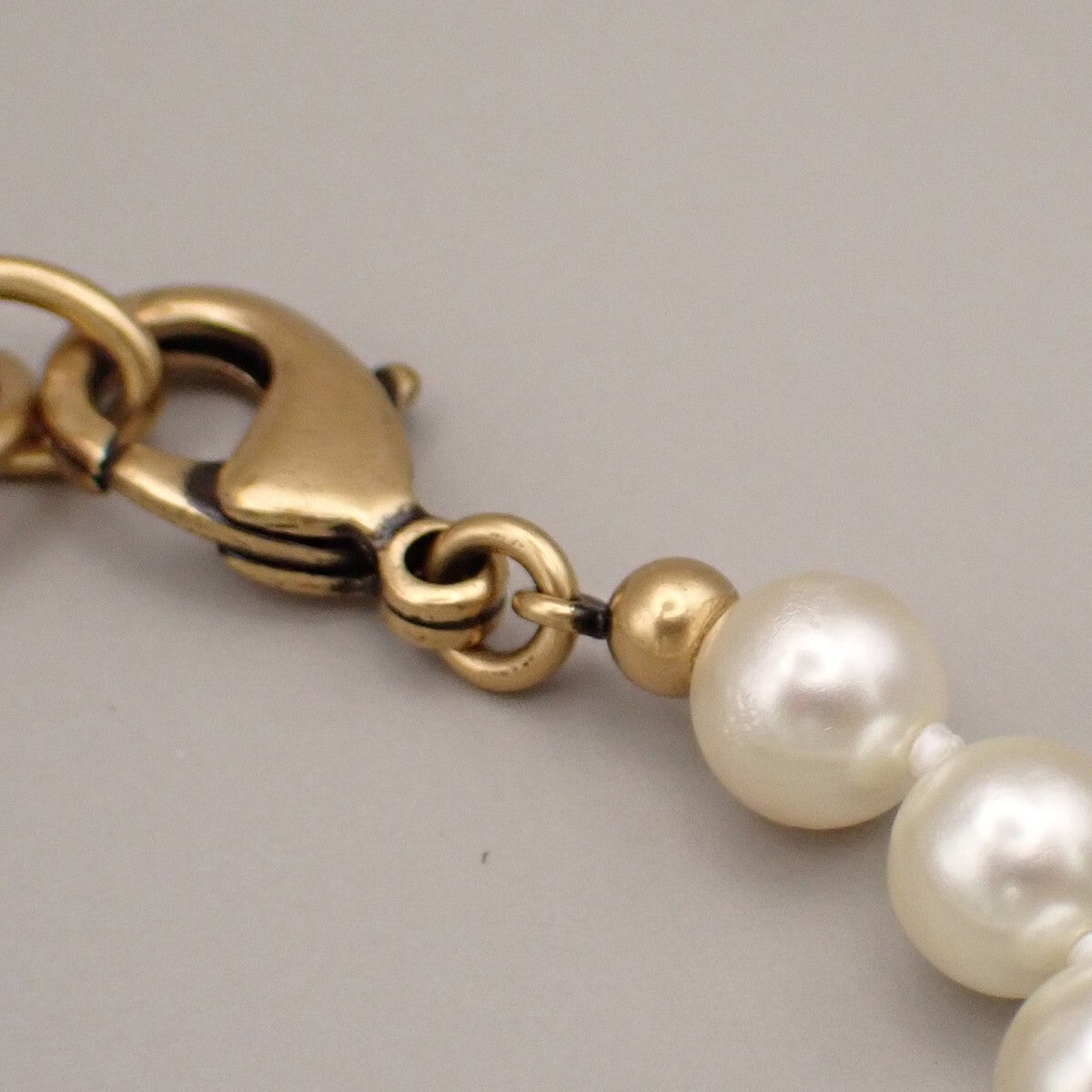 CHRISTIAN DIOR Logo Tribal Imitation Pearl Necklace White Gold 88RK382