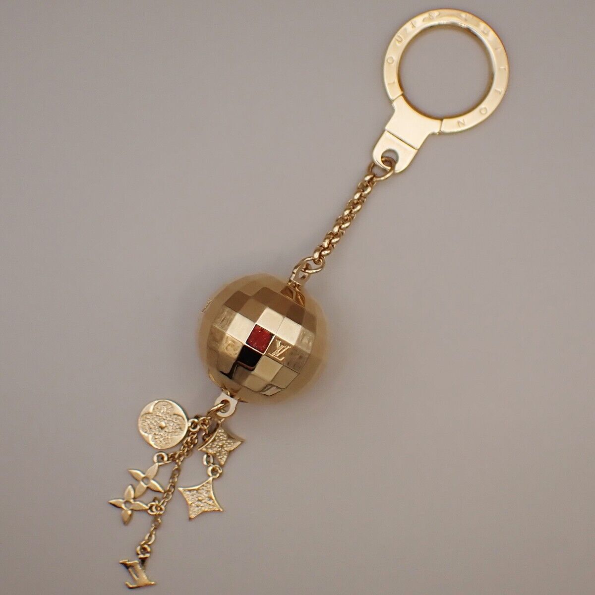 LOUIS VUITTON Porte Cles Glitter Mirror Ball Charm Key Ring GD M65379 64YG570